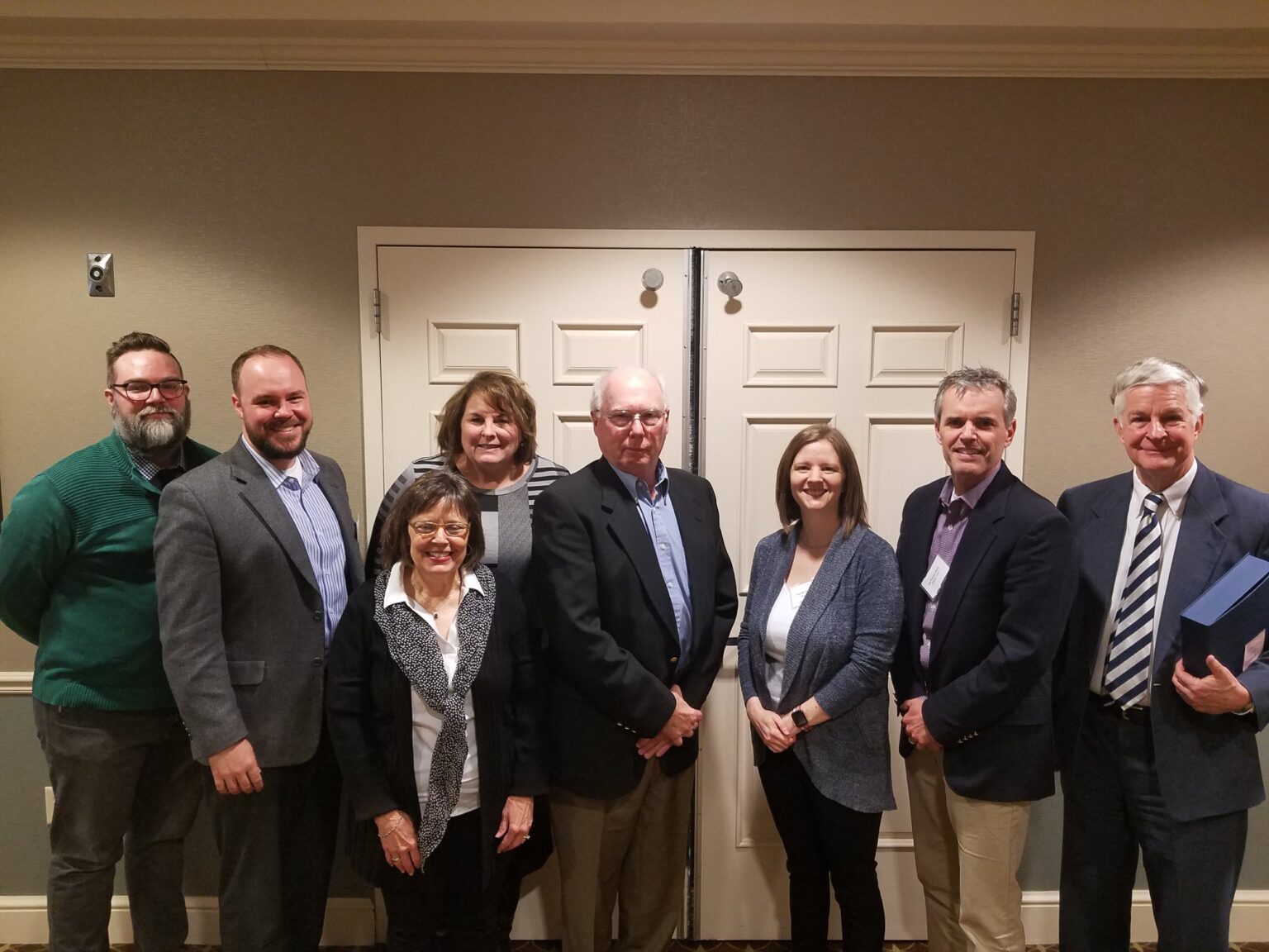 Members pose for a group photo while attending an IPA conference.